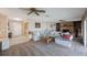 Spacious living room with a brick fireplace, built-in bookshelves, and comfortable seating at 4701 Lodestone Dr, Tampa, FL 33615