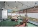 Cozy sunroom with cushioned seating, strung lights, a ceiling fan and outdoor views at 4701 Lodestone Dr, Tampa, FL 33615