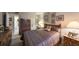 Cozy bedroom with a large bed, dresser, and decorative artwork, creating a relaxing atmosphere at 5557 Baywater Dr, Tampa, FL 33615