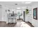 Bright kitchen with white cabinetry, granite countertops, and stainless steel appliances at 7234 12Th N St, St Petersburg, FL 33702