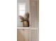 Chic interior featuring natural wood cabinets, a woven vase with dried flowers, and a light-filled space at 128 Adriatic Ave, Tampa, FL 33606