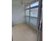 Enclosed sunroom with many windows providing plenty of natural light at 3115 Mission Grove Dr, Palm Harbor, FL 34684