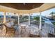 Charming balcony with seating offering neighborhood views and tropical landscaping at 335 Bath Club S Blvd, North Redington Beach, FL 33708