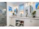Elegant bathroom featuring dual vessel sinks, granite counters, and a glass-enclosed shower at 335 Bath Club S Blvd, North Redington Beach, FL 33708