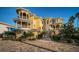 Stunning multi-story home featuring stone accents, balconies and lush landscaping at 335 Bath Club S Blvd, North Redington Beach, FL 33708