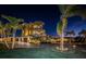 Elegant multi-story home with manicured lawn and a circular driveway at 335 Bath Club S Blvd, North Redington Beach, FL 33708