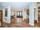 Spacious foyer featuring wood-look tile flooring, staircase and double front doors at 335 Bath Club S Blvd, North Redington Beach, FL 33708