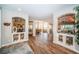 Open-concept living area with stylish built-ins, modern decor, and water feature at 335 Bath Club S Blvd, North Redington Beach, FL 33708