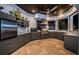 Gourmet outdoor kitchen with stainless steel appliances and stylish countertops at 335 Bath Club S Blvd, North Redington Beach, FL 33708