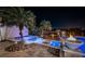 Lush landscaping frames a luxury pool and spa area complete with fire bowls at 335 Bath Club S Blvd, North Redington Beach, FL 33708