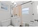 Bright bathroom with a shower-tub combo, clean finishes, and charming decor at 4210 Harrisburg Ne St, St Petersburg, FL 33703
