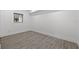 Empty bedroom featuring tile flooring and natural light from the window at 4210 Harrisburg Ne St, St Petersburg, FL 33703