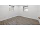 Empty bedroom featuring tile flooring and natural light from the two windows at 4210 Harrisburg Ne St, St Petersburg, FL 33703