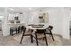 Dining area with a modern table, stylish chairs, and elegant decor at 4210 Harrisburg Ne St, St Petersburg, FL 33703