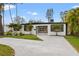 Charming single-story home with a well-manicured lawn and inviting front entrance at 4210 Harrisburg Ne St, St Petersburg, FL 33703