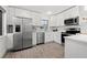 Modern kitchen featuring stainless steel appliances, white cabinetry and beautiful countertops at 4210 Harrisburg Ne St, St Petersburg, FL 33703
