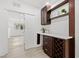 Living room featuring a built-in bar area and tile floors at 4210 Harrisburg Ne St, St Petersburg, FL 33703