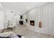 Bright living room with tiled fireplace and neutral-toned decor at 4210 Harrisburg Ne St, St Petersburg, FL 33703