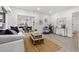 Bright living room featuring tile floors, neutral furniture and decor at 4210 Harrisburg Ne St, St Petersburg, FL 33703