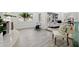 Open-concept living room with tile floors and plenty of natural light at 4210 Harrisburg Ne St, St Petersburg, FL 33703