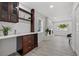 Living room with tiled fireplace and built-in bar area at 4210 Harrisburg Ne St, St Petersburg, FL 33703
