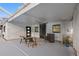 Covered patio featuring a ceiling fan, doors, and outdoor furniture at 4210 Harrisburg Ne St, St Petersburg, FL 33703