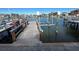 Well-maintained private dock with wooden deck, boat lift and gorgeous waterfront views at 439 Boca Ciega Point N Blvd, St Petersburg, FL 33708