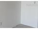 Clean empty room featuring fresh white paint, tile floor and neutral trim at 439 Boca Ciega Point N Blvd, St Petersburg, FL 33708