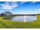 Scenic view of the pond with a home in the background at 5811 Arbor Wood Ct, Bradenton, FL 34203