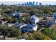 Aerial view of neighborhood homes and Tampa skyline in the distance on a sunny day at 818 W Adalee St, Tampa, FL 33603