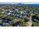 Scenic aerial view of a neighborhood with lush trees and the downtown skyline in the background at 818 W Adalee St, Tampa, FL 33603