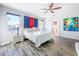 Bright bedroom with hardwood floors, ceiling fan, large windows, and a serene atmosphere at 818 W Adalee St, Tampa, FL 33603