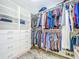 Walk-in closet with custom shelving and ample storage space for clothes and accessories at 818 W Adalee St, Tampa, FL 33603