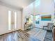 Bright foyer with double-door entry, high ceilings, modern decor, and wood-look floors at 818 W Adalee St, Tampa, FL 33603