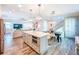 Spacious kitchen with a large island, stainless steel appliances, and an open view to the living area at 818 W Adalee St, Tampa, FL 33603