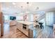 Open kitchen with a center island, modern appliances, and a view of the living area and dining space at 818 W Adalee St, Tampa, FL 33603