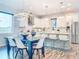 Modern kitchen with stainless steel appliances, white cabinets, and a spacious island with bar seating at 818 W Adalee St, Tampa, FL 33603