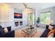 Cozy living room with modern furnishings, built-in shelving, and plenty of natural light at 818 W Adalee St, Tampa, FL 33603
