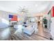 Spacious open-concept living room with modern decor, hardwood floors, and ample natural light at 818 W Adalee St, Tampa, FL 33603