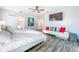 Spacious main bedroom with en-suite bathroom, modern lighting, and comfortable seating area at 818 W Adalee St, Tampa, FL 33603