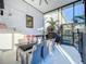 Enclosed patio featuring a dining table, chairs, and a grill, perfect for outdoor entertaining and gatherings at 818 W Adalee St, Tampa, FL 33603