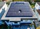 Aerial view of a home equipped with modern solar panels, representing eco-friendly energy solutions at 818 W Adalee St, Tampa, FL 33603