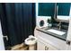 The bathroom has a white toilet, white cabinets, granite countertops, and a sink with chrome fixtures at 895 64Th S Ave, St Petersburg, FL 33705