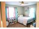 Bright bedroom with colorful accents, curtains, and a whimsical design that evokes a sense of creativity at 895 64Th S Ave, St Petersburg, FL 33705