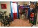 Unique room featuring a loft bed with a desk underneath, a basketball hoop, drum set, and vibrant decor at 895 64Th S Ave, St Petersburg, FL 33705
