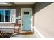 Inviting front entryway with a charming blue door and decorative accents at 895 64Th S Ave, St Petersburg, FL 33705