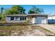 Charming single-story home featuring well-maintained landscaping and a cozy front porch at 895 64Th S Ave, St Petersburg, FL 33705