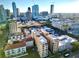 An aerial view of the building with the city's skyline in the background on a beautiful sunny day at 130 4Th N Ave # 414, St Petersburg, FL 33701