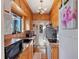 Efficient kitchen with wood cabinets, granite countertops, stainless steel appliances, and ample natural light at 130 4Th N Ave # 414, St Petersburg, FL 33701