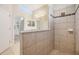 Bright bathroom featuring a glass enclosed shower with neutral tile, granite counters, and vanity at 19724 Post Island Loop, Land O Lakes, FL 34638